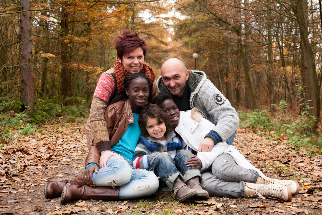 Happy,Family,With,Foster,Children,In,The,Forest